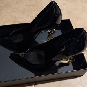 Saint Laurent Black Patent Pumps with Gold Monogram Heels